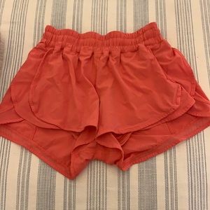 Pink/coral size 6 Lululemon shorts. 2.5 inch inseam. Good condition.